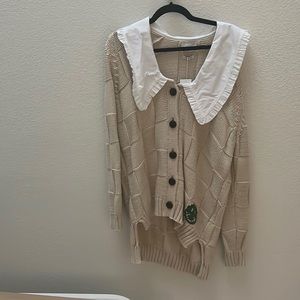 White or cream cardigan sweater